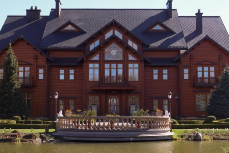 Stunning exterior view of Kirk Herbstreit House showcasing its elegant design and beautiful landscaping in Franklin, Tennessee.