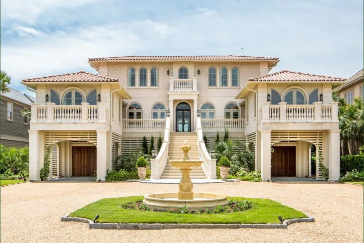 A luxurious view of the Jerry Buss House, showcasing its Mediterranean architecture and elegant design features.